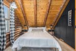 A queen bed and plenty of storage in this upper level guest room